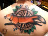 fox/compass back piece tattoo