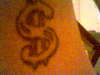 another view of the dollar sign tattoo