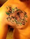 Charging Bull with green smoke tattoo