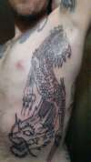 Dragon rip out arm pit tattoo