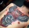 Owl/cat skull chest piece tattoo