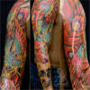 Phoenix Rising from a Broken Skull tattoo