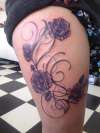 flower thigh peice tattoo