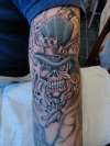skull/hat tattoo