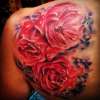 Watercolor flower tattoo by Steve'O
