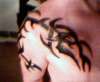 Tribal on chest, arm and back tattoo