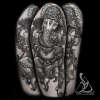 Black and Grey Ganesha half sleeve tattoo on upper arm. Done by