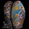 Blue and Gold koi fish swimming up and jumping out of fingerwave tattoo