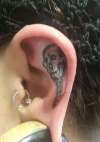 SKULL INNER LEFT EAR tattoo