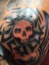 Skull tribal sun tattoo