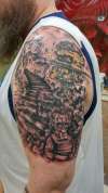 Upper arm piece tattoo