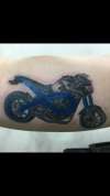 Cancer ribbon/motorbike tattoo