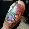 Flower arm piece tattoo