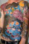 Foo dog and snake lady tattoo
