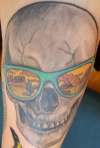 Skull with reflection on sunglasses tattoo