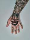Demon hand tattoo