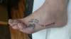 Overlapping pinky toe tattoo