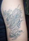 Emerging dragon tattoo