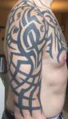 Massive pec and shoulder tribal tattoo