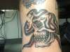 Skull with Snakes tattoo