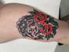 Black sheep with roses tattoo