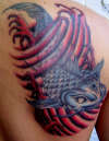 coil fish tattoo