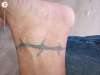 Barbwire ankle band tattoo