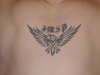 tribal eagle and initials tattoo