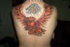 Phoenix around Rose tattoo