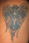 Tribal Cross over angelic wings tattoo