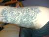 demon and skulls tattoo