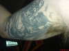 demon holding fire tattoo