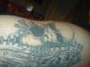 alien comin through skin tattoo