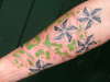 Dotty trible cherry blossom with freehand wave's. tattoo