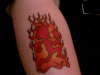 Hatchetman in front of flames tattoo
