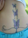 Gorgeous lower back tattoo (rising up)