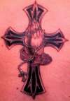 Preying hands with cross tattoo