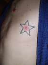 Nipple star tattoo