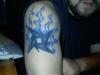 Metallica star and flames tattoo