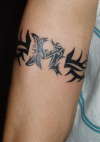 tribal M tattoo