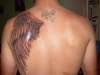 left side (angel wing) tattoo