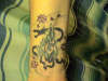 dragon/bird/flowers right wrist tatt tattoo