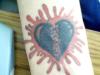 heart on wrist tattoo