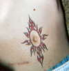 TRIBAL SUN ON STOMACH tattoo