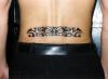 Polynesian lower back tattoo