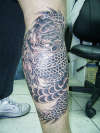 Freehand Dragon on lower leg tattoo