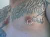 Tiger and nipple piercing tattoo