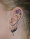 Ear Flower tattoo