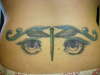 dragonfly and eyes tattoo