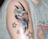 skull,flowers and stars tattoo